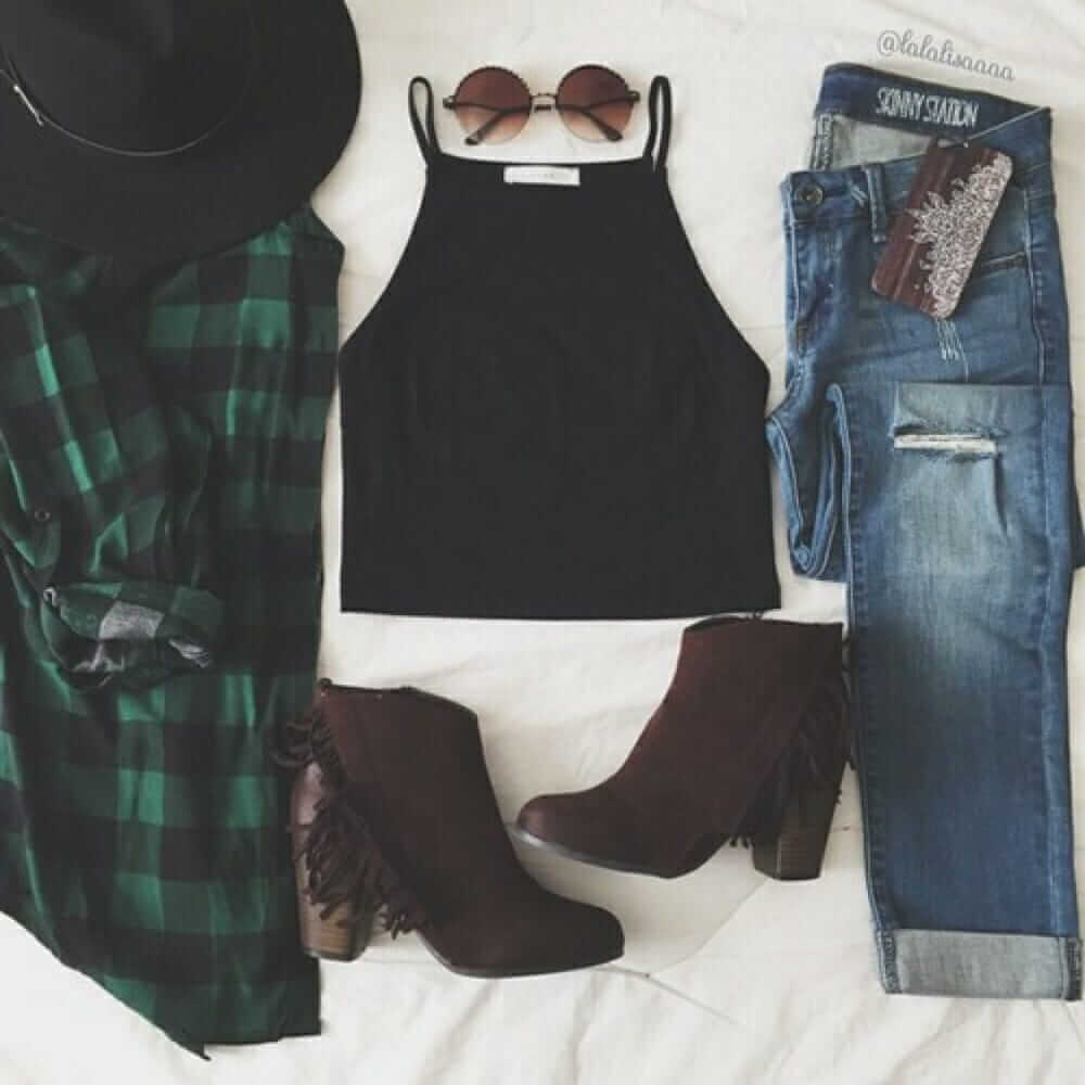 Grunge outfit idea nº15: Green plaid shirt, torn jeans, cowboy tassel boots, wide brim hat, brown tinted glasses, and black sleeveless T