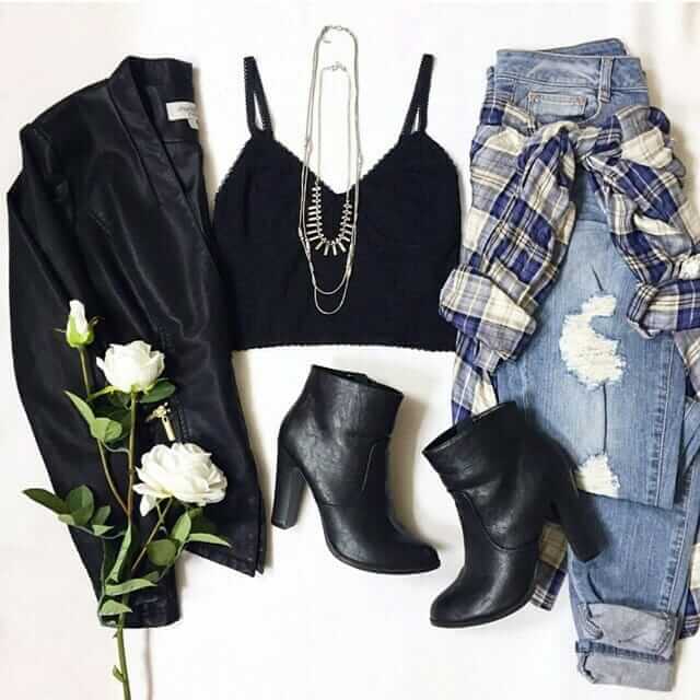 Grunge outfit idea nº19: Black leather jacket, plaid shirt, black heel boots, torn light blue jeans, and no-sleeve T