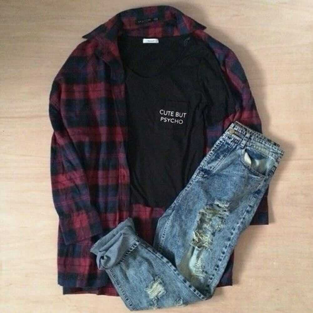 Grunge outfit idea nº7: Dark flannel patterned shirt, ripped blue jeans, black T