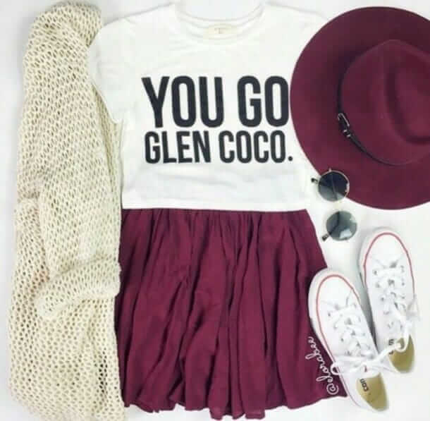 6. White crop top with a maroon skirt, white Chuck Taylors, a maroon wide brimmed hat, some shades, and a cream knit sweater