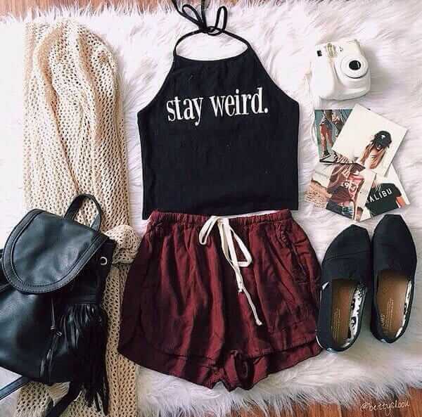 Hipster outfit idea: black high-neck halter top, brown shorts, knitted sweater and black canvas shoes