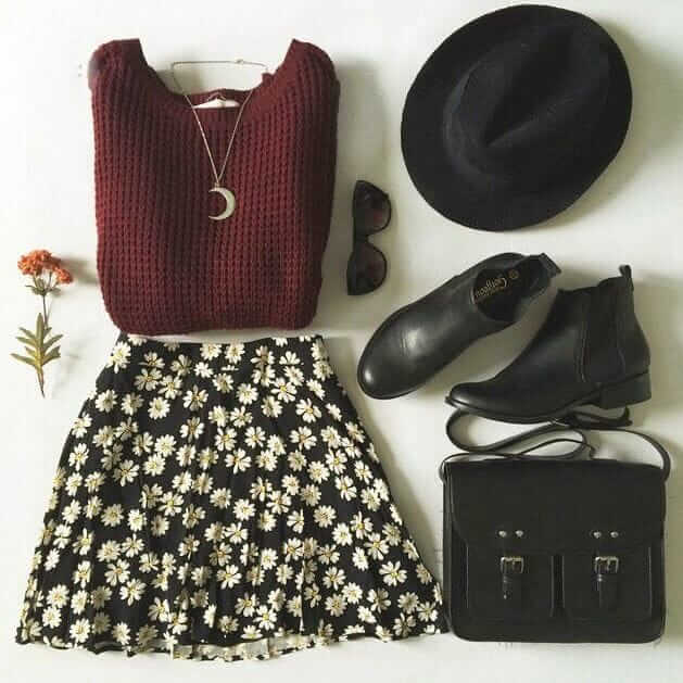Brown knitted top, flowery skirt, leather handbag, black booties, hat and sunglasses