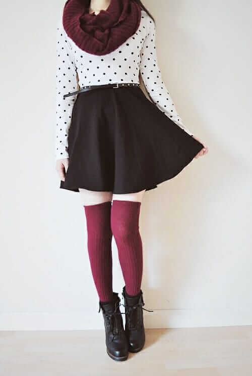 Cotton long-sleeved dotted t-shirt, flared black skirt, above the knee and maroon knee-high socks