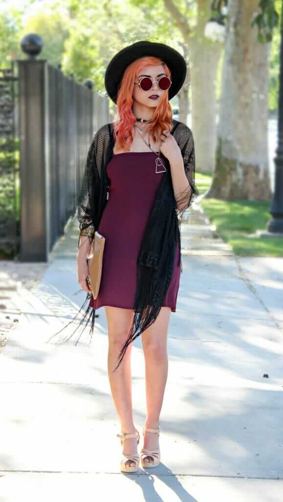 Oriana Shift dress in deep purple, a copper necklace, a pair of Nude sandals, and a thrifted leather clutch, black lace shawl, reflective round sunglasses, and round black felt-hat