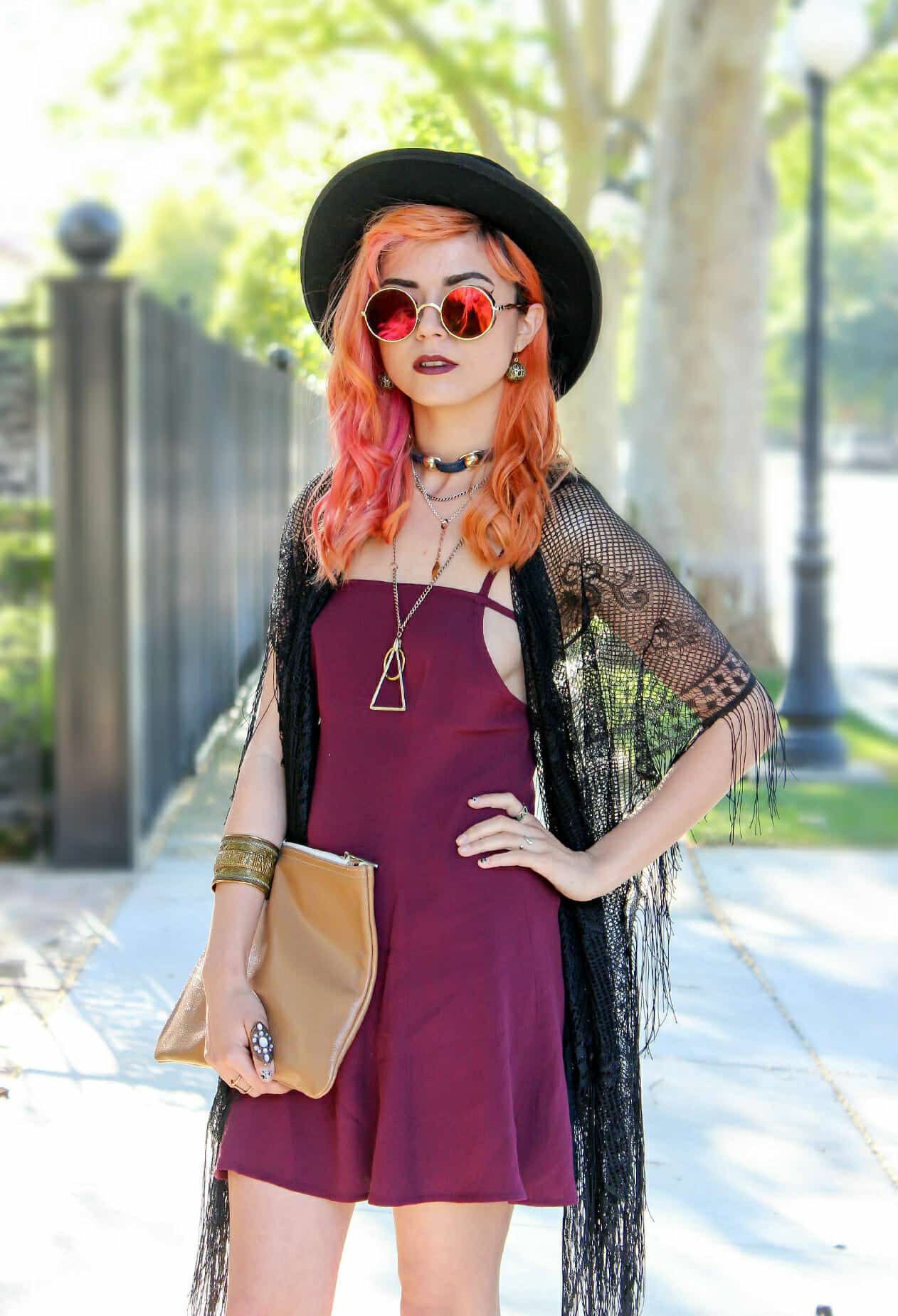 Oriana Shift dress in deep purple, a copper necklace, a thrifted leather clutch, black lace shawl, reflective round sunglasses, and round black felt-hat