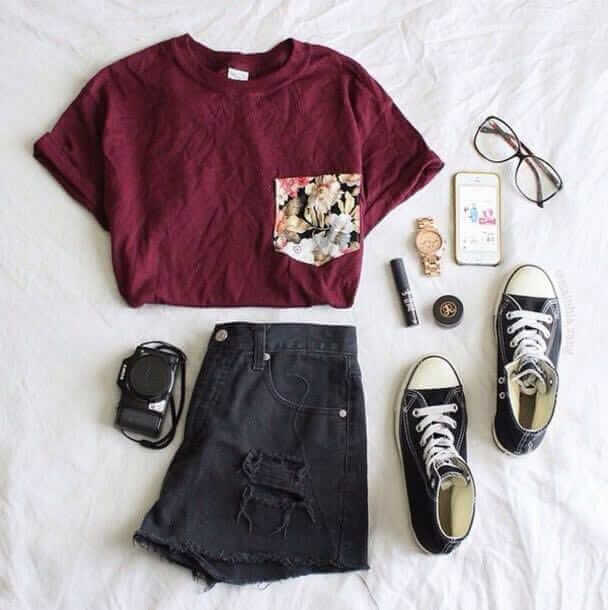 12. Maroon T with a floral print pocket, ripped black jean shorts, high top All-Stars, and clear wide rimmed glasses