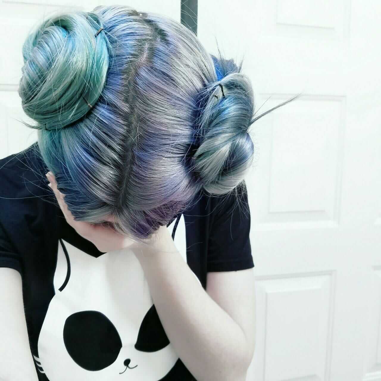 Grunge dyed turquoise and blue hair with buns