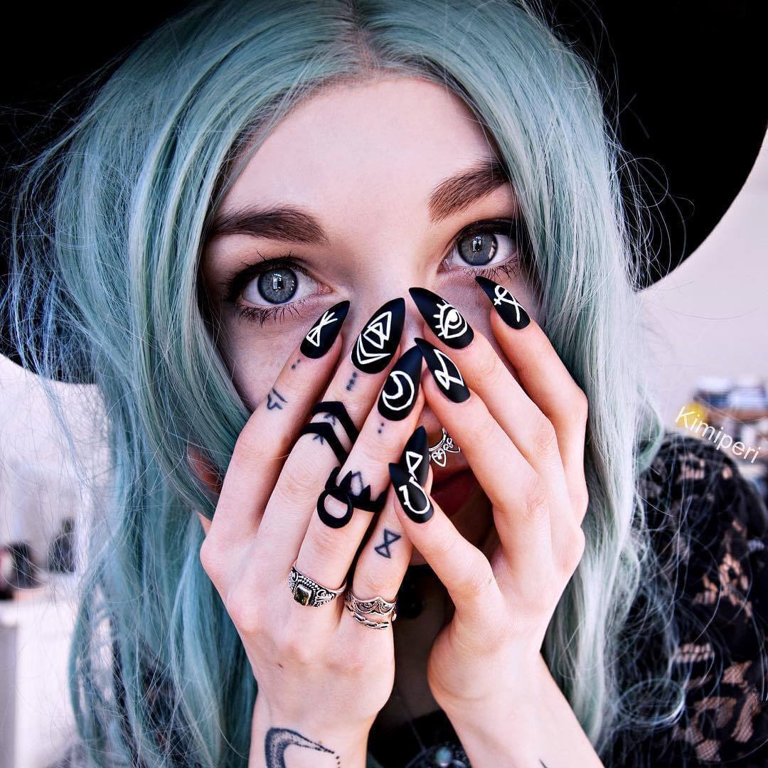 Black matte nails with Rogue & the Wolf rings