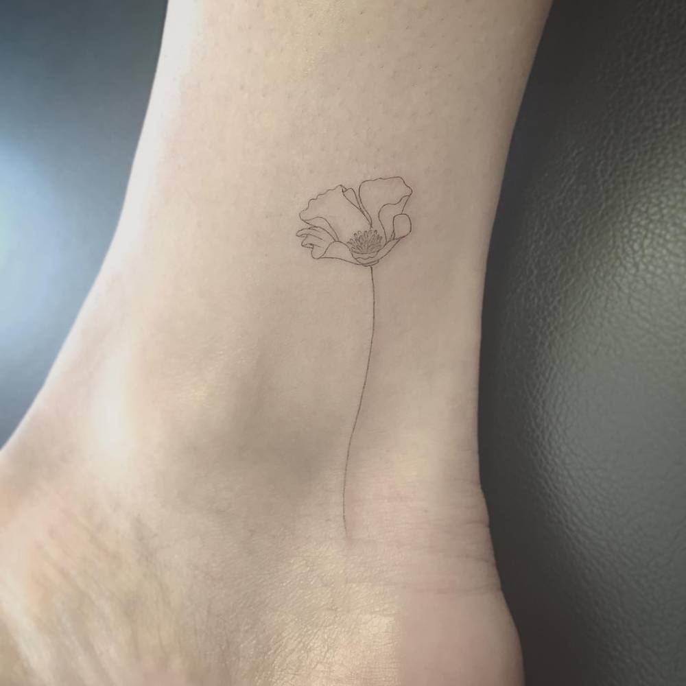 Fine line style poppy on the ankle
