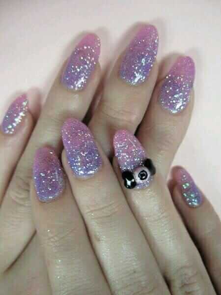 Pastel glitter nails with eye decoration