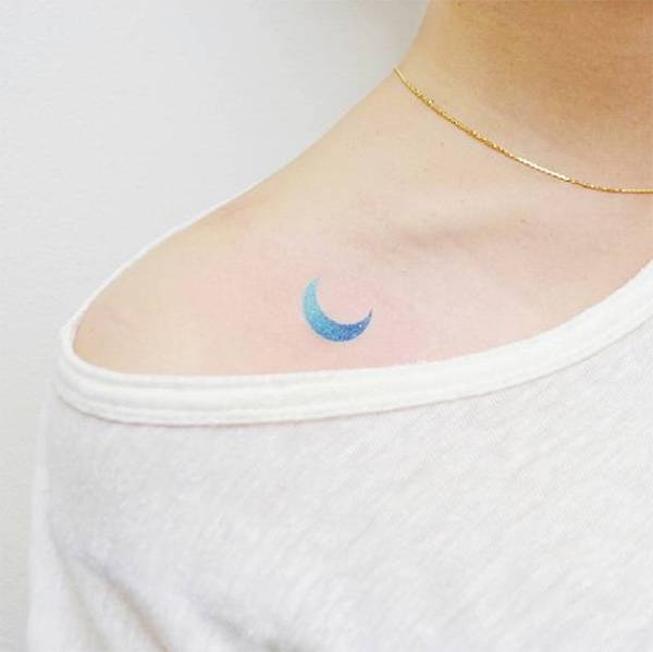 Watercolor style blue moon on the collarbone
