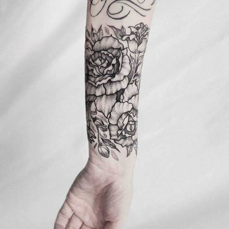 Rose flower tattoo in the forearm by dogma_noir