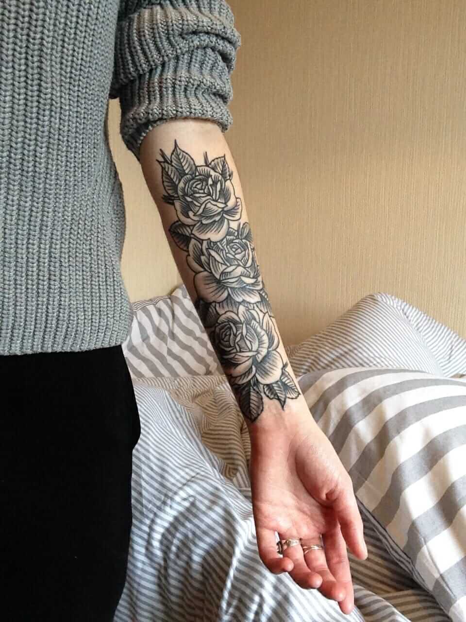 Multiple roses inked on forearm