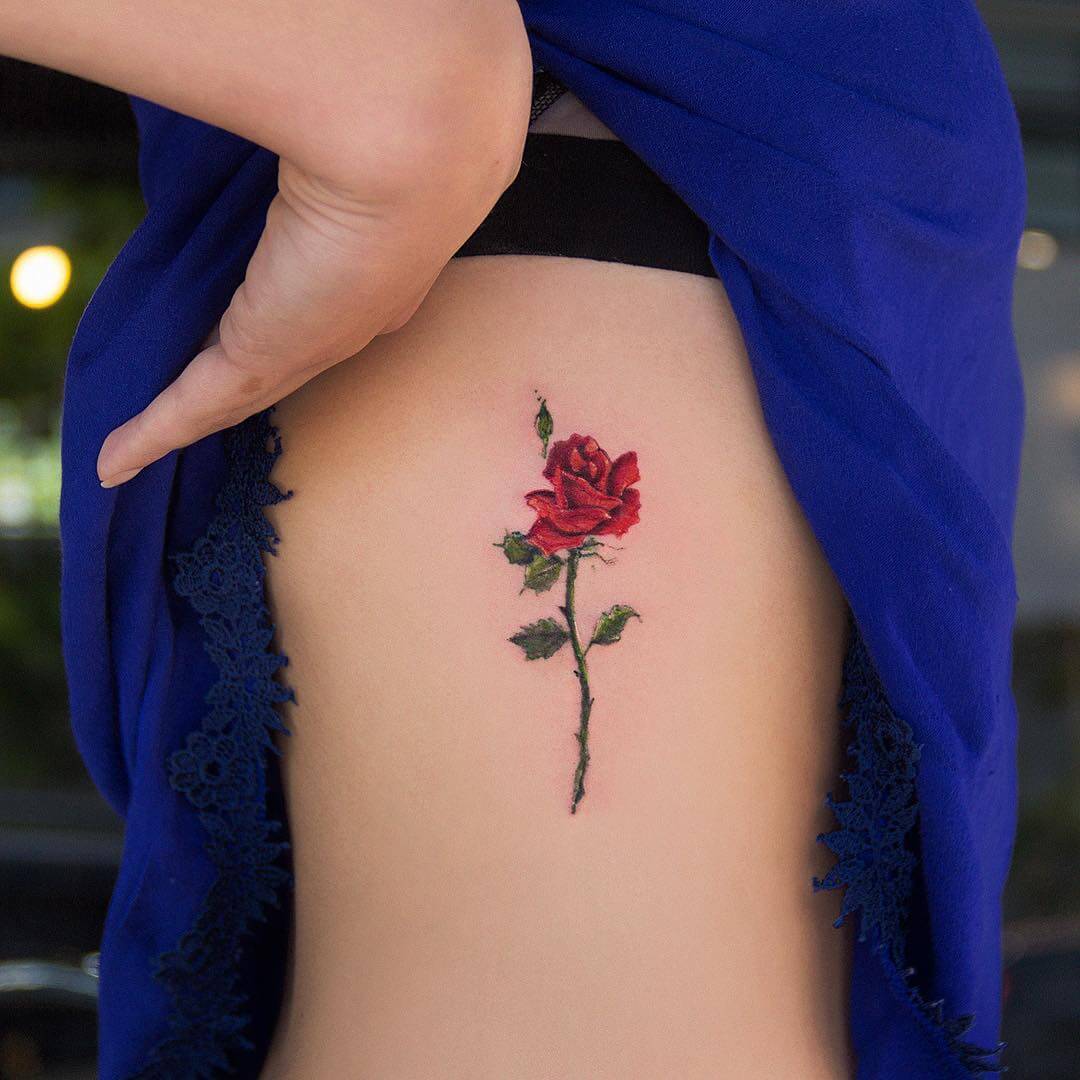 Colored rose tattoo on ribs by robcarvalhoart