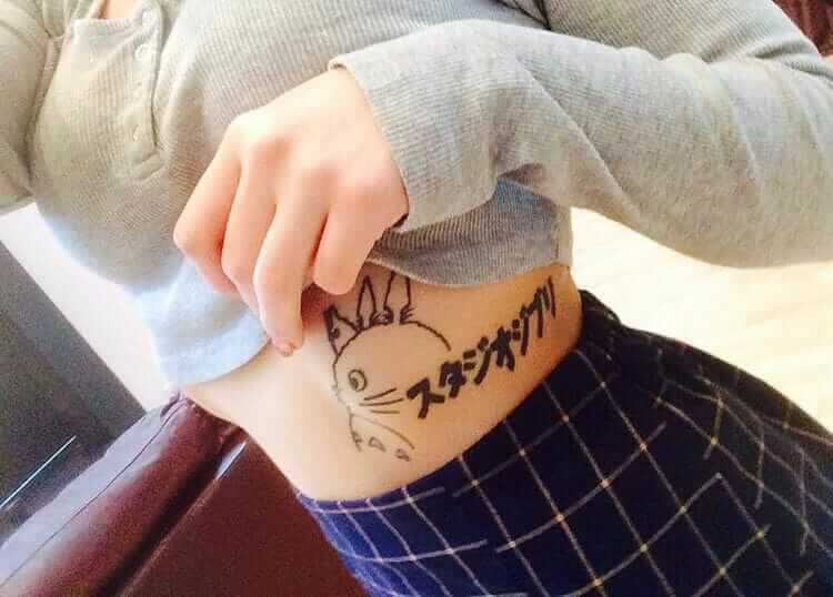Studio Ghibli logo ribs tattoo by onehellofawaifu