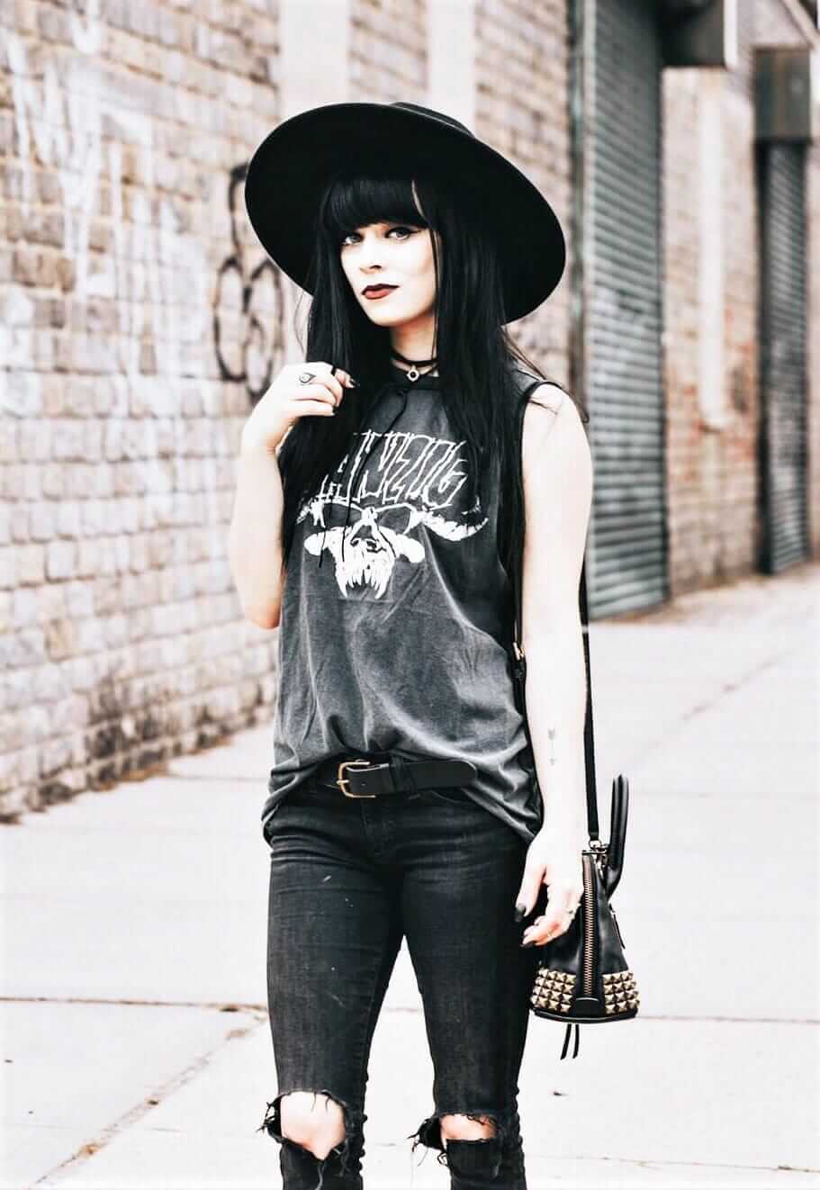 Black round hat, necklace, danzig shirt, ripped jeans & coach bag by jaglever