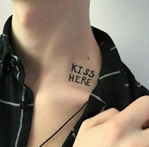 "kiss here" words tattoo
