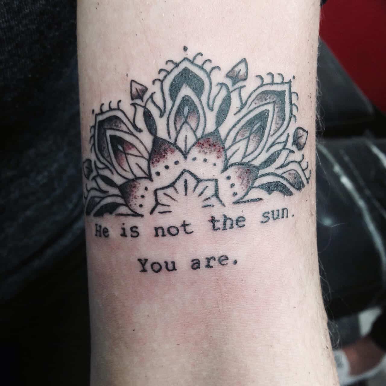 "He is not the sun. You are." quote with mandala graphic tattoo