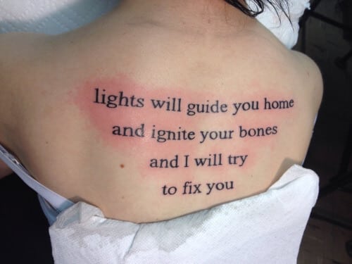 "Lights will guide you home and ignite your bones. And I will try to fix you" back quote tattoo