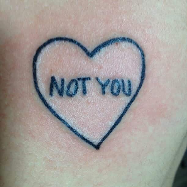 "Not you" with heart graphic tattoo