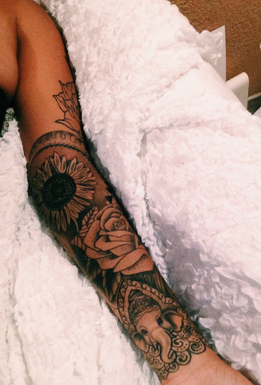 Sunflower and rose sleeve tattoo