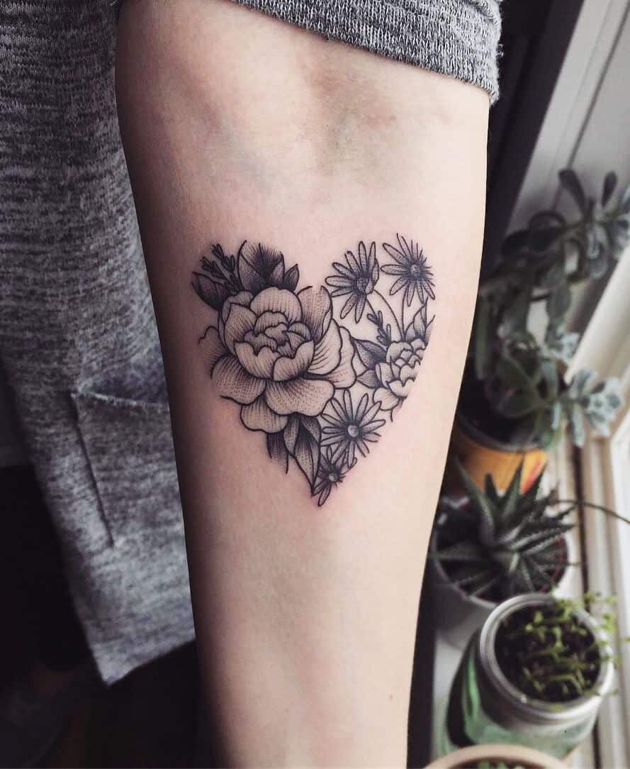 Heart shape with flowers tattoo