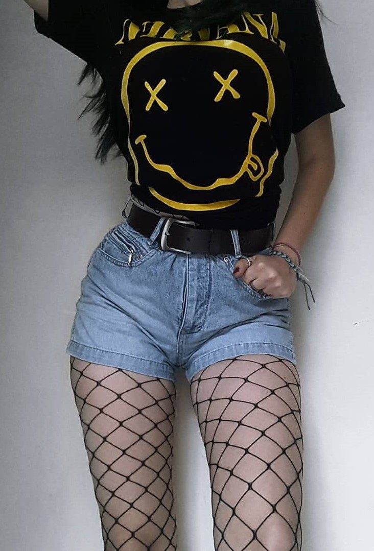 jean shorts worn with black hose  90s fashion, 90s high waisted jeans, 90s  fashion outfits
